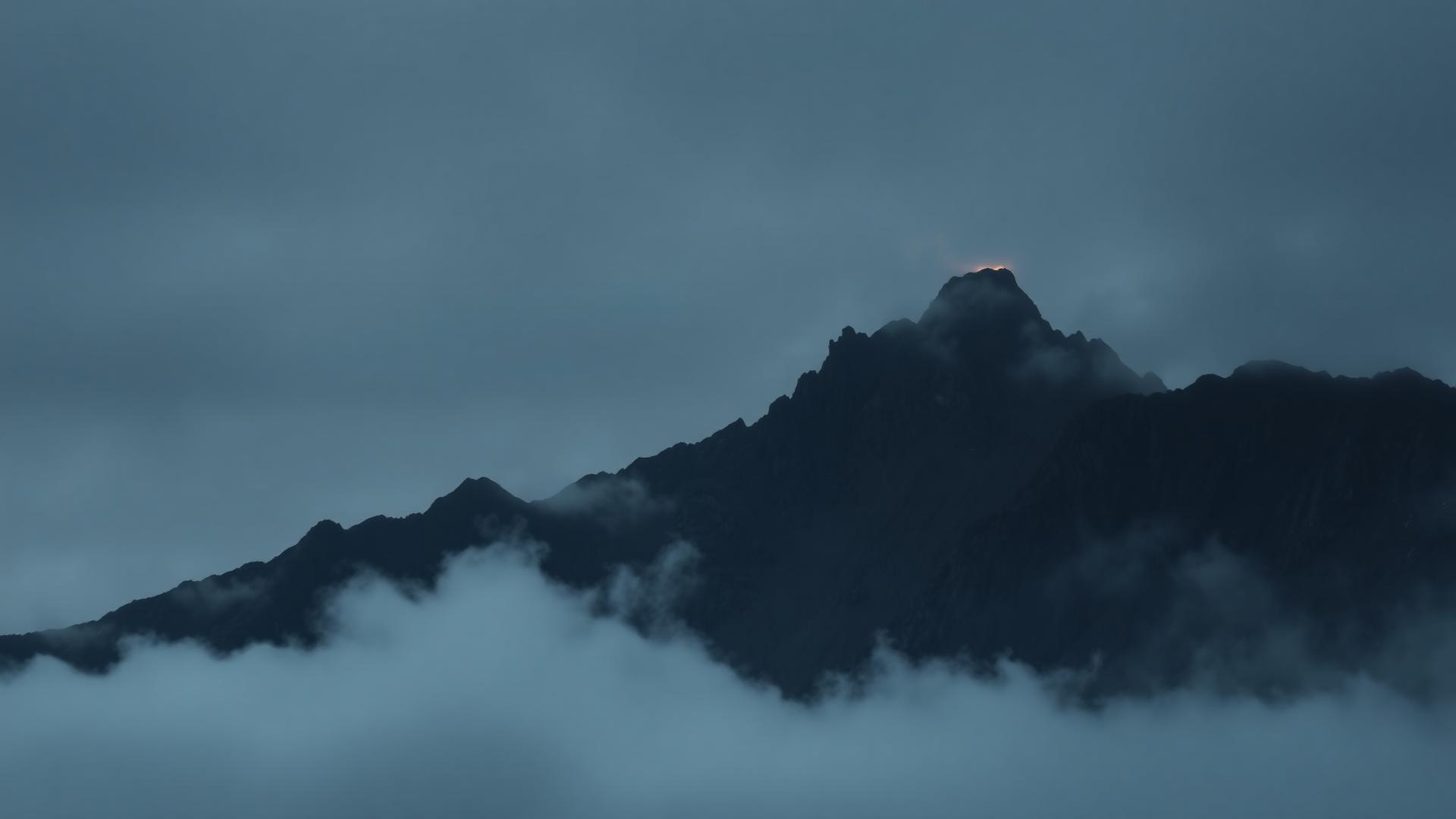 Dark mountain ridge at dawn